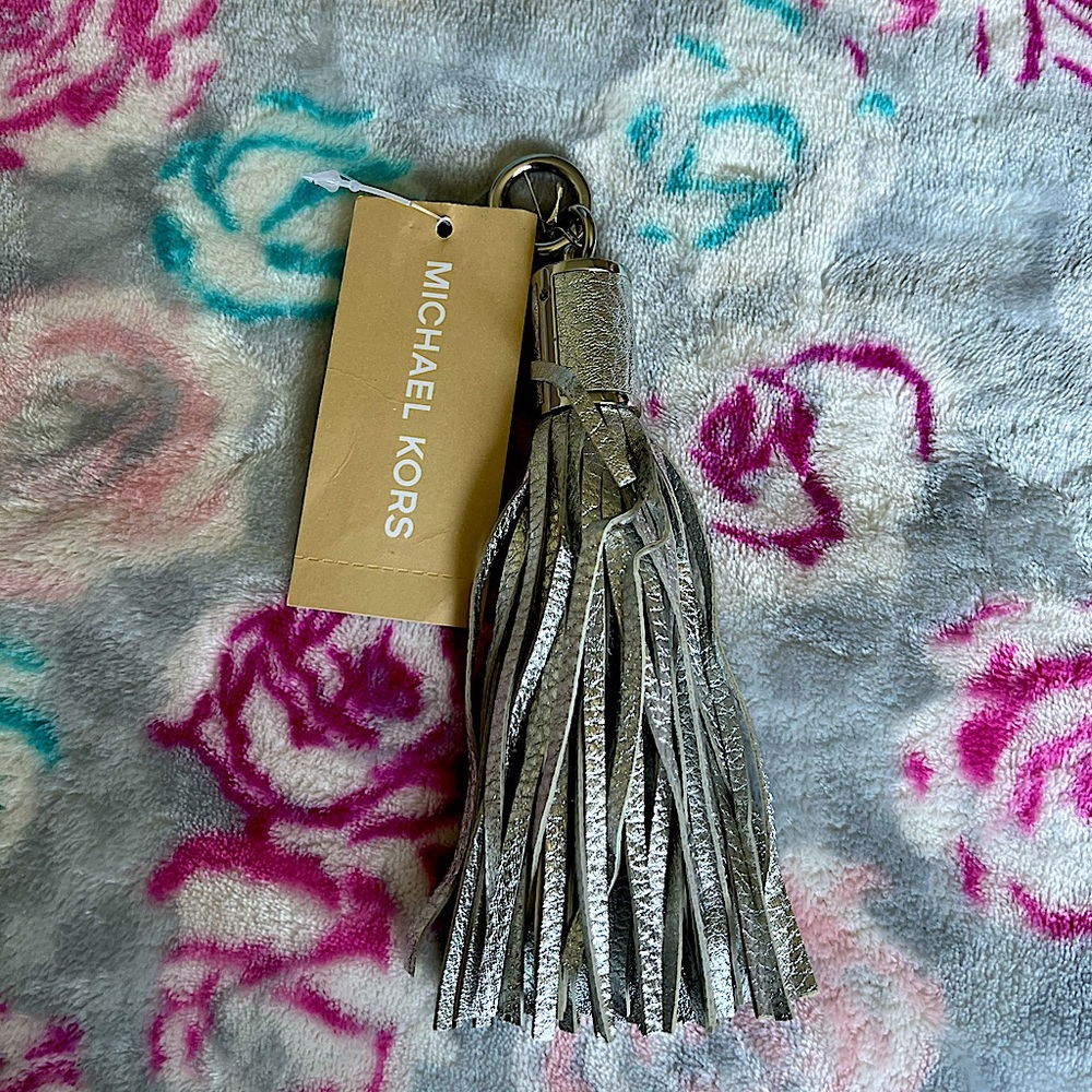 MICHAEL KORS SILVER TASSEL CHARM